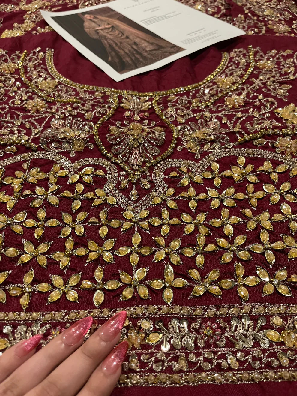 Faiza Saqlain Muntaha luxury bridal couture outfit front view featuring heavily hand-embellished raw silk shirt with intricate resham, dabka, naqshi and sequin embroidery in Mughal inspired floral motifs, paired with voluminous lehenga adorned with multiple richly embroidered borders and antique finishing, completed with a gracefully draped zari net dupatta with detailed adda work and ornate edging, premium bridal ensemble perfect for weddings, nikkah ceremonies and luxury festive occasions