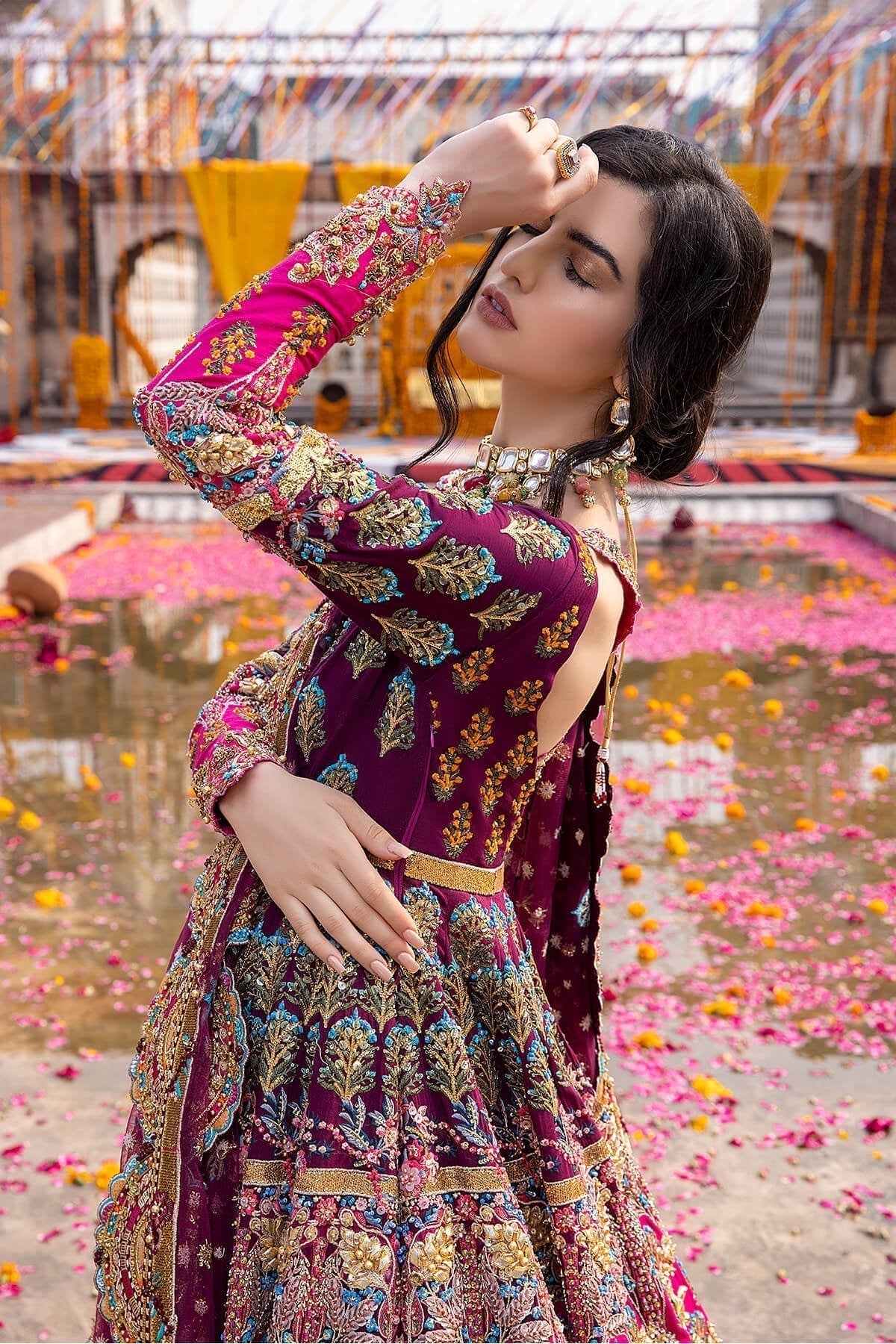 Mina Kashif Mahrosh luxury Pakistani formal ensemble featuring intricate hand embellishments and refined craftsmanship on a gracefully draped silhouette, perfect for weddings and formal occasions.