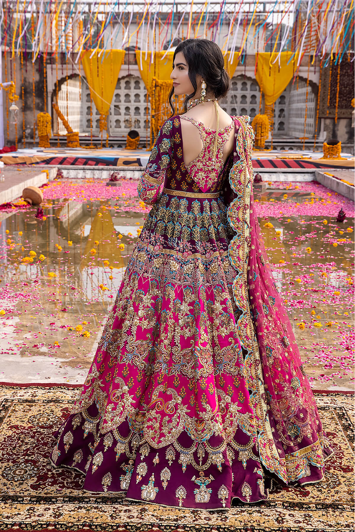 Mina Kashif Mahrosh luxury Pakistani formal ensemble featuring intricate hand embellishments and refined craftsmanship on a gracefully draped silhouette, perfect for weddings and formal occasions.