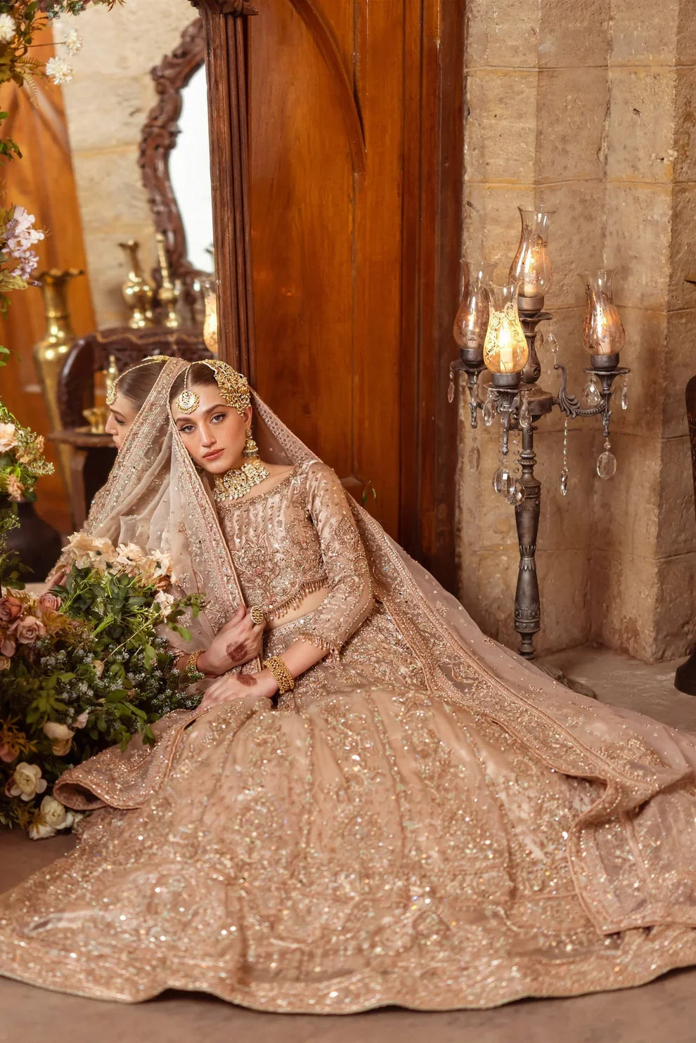 Naqshi Shabaab luxury formal couture outfit front view featuring heavily hand-embellished long shirt with intricate naqshi, dabka, kora, sitara, cutdana and crystal embroidery arranged in rich Mughal inspired floral and geometric patterns, detailed neckline and sleeves with full adda work, paired with matching embroidered trousers and heavily decorated dupatta with ornate borders, fine resham threadwork and shimmering sequin spray, premium Pakistani designer outfit perfect for weddings, festive occasions, m