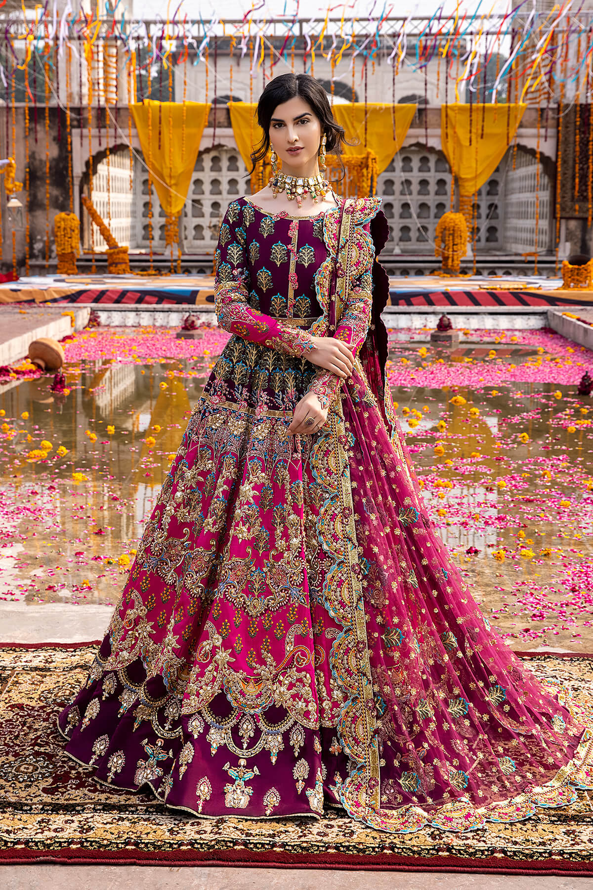 Mina Kashif Mahrosh luxury Pakistani formal ensemble featuring intricate hand embellishments and refined craftsmanship on a gracefully draped silhouette, perfect for weddings and formal occasions.