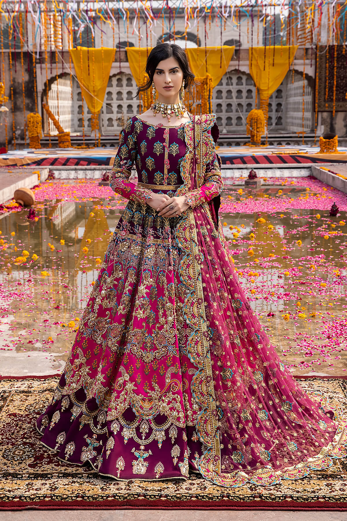 Mina Kashif Mahrosh luxury Pakistani formal ensemble featuring intricate hand embellishments and refined craftsmanship on a gracefully draped silhouette, perfect for weddings and formal occasions.