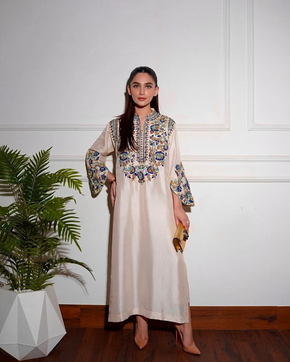 Elegant white designer embroidered suit with trousers
Premium Aleena Khan formal ensemble detailed embroidery close up
Aleena Khan white festive outfit full look for women