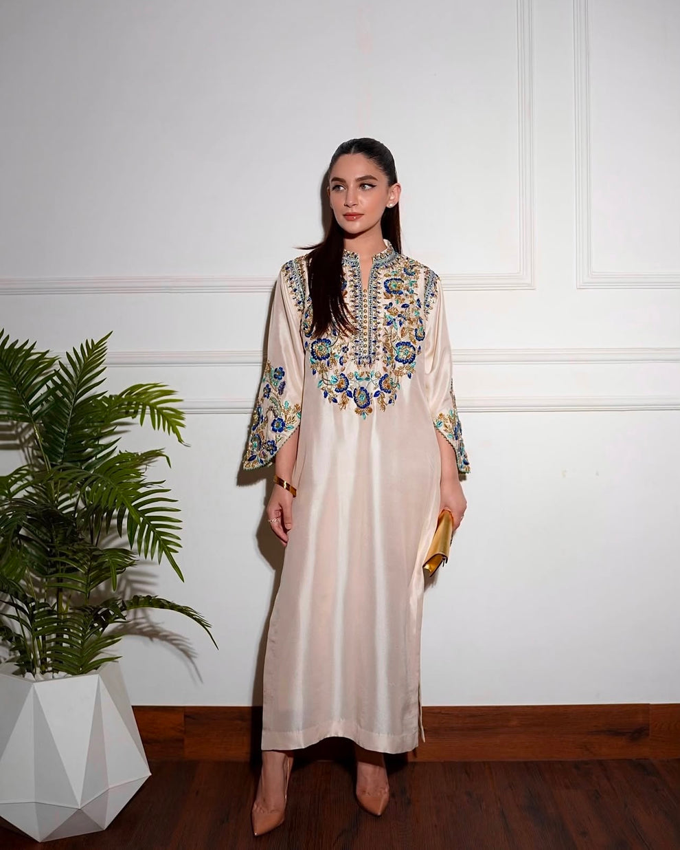 Elegant white designer embroidered suit with trousers
Premium Aleena Khan formal ensemble detailed embroidery close up
Aleena Khan white festive outfit full look for women