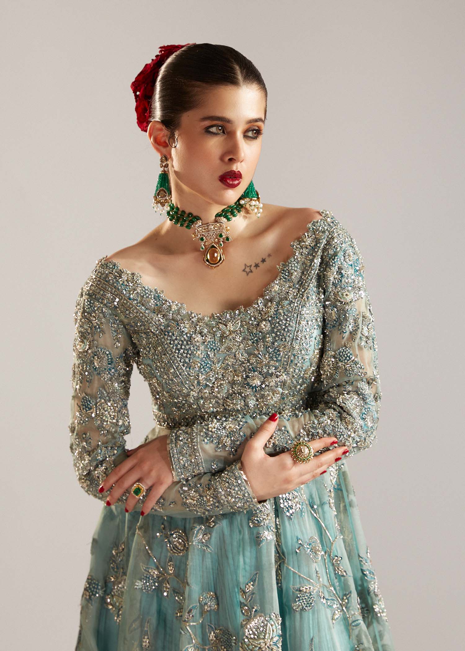 Closeup of Astra ice blue peshwas bodice featuring intricate embroidery and embellishment details