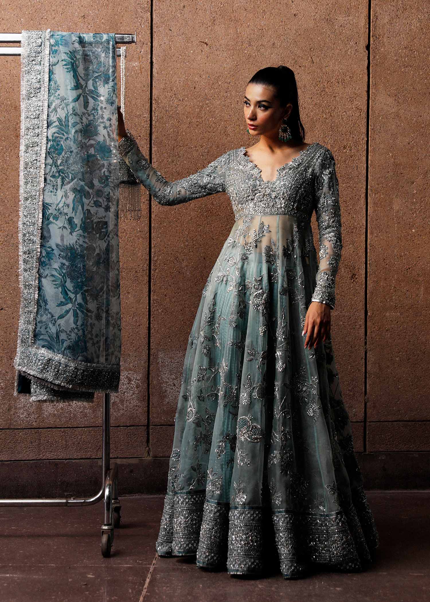 Fashion model in Astra ice blue luxury peshwas sharara showcasing complete formal look