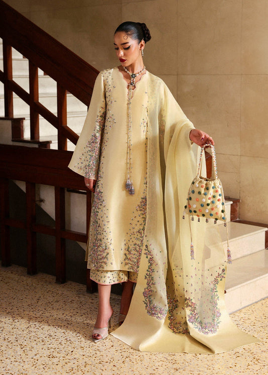 Front view of butter yellow embroidered Pakistani formal dress with organza dupatta