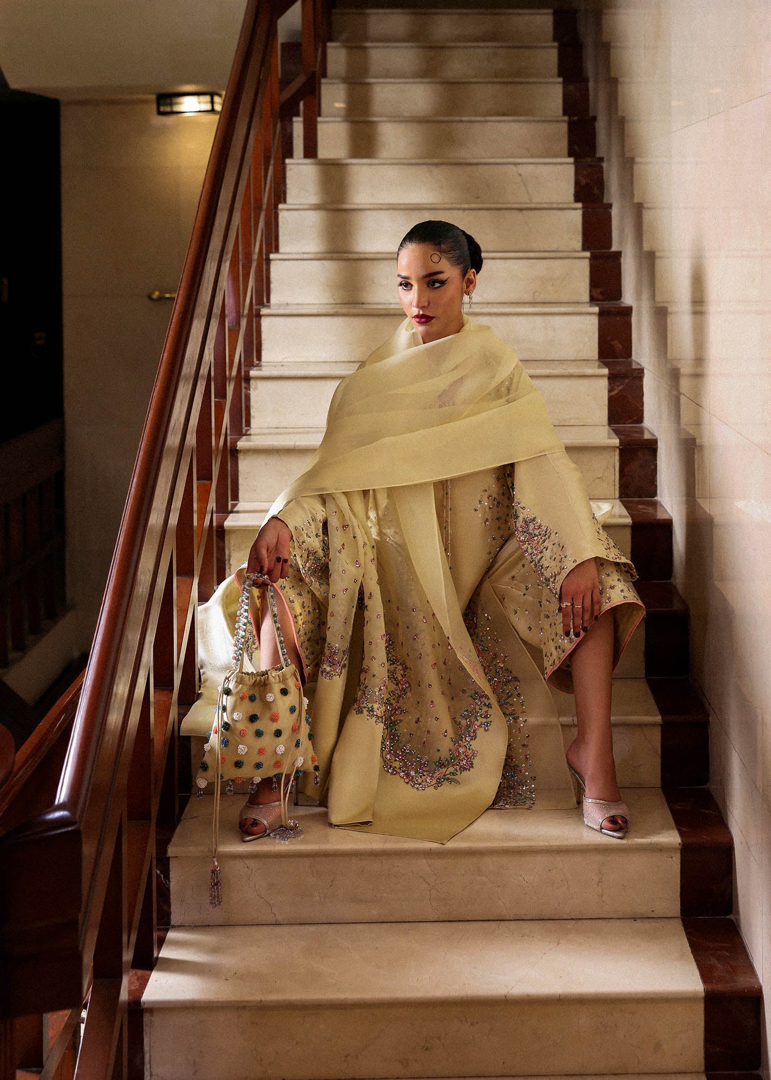 Full view of embroidered organza dupatta on butter yellow Pakistani dress