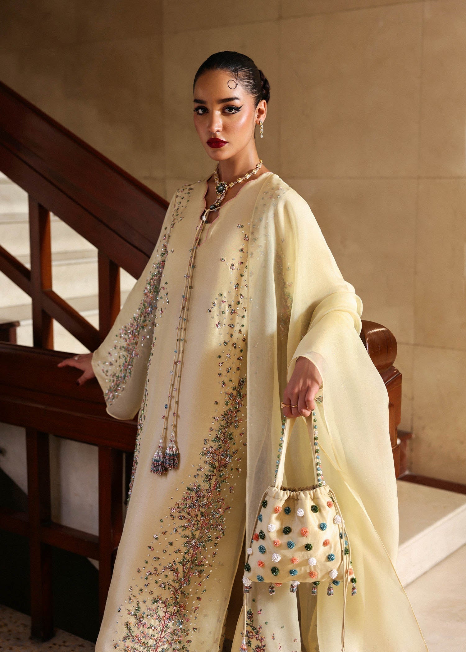 Close up embroidery on sleeves of butter yellow Pakistani outfit