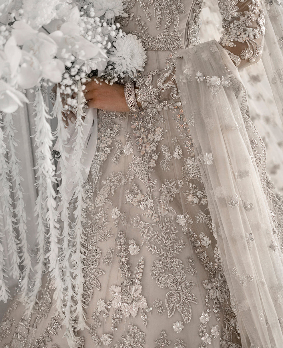 Republic Womenswear  bridal ensemble with intricate floral embroidery
Luxury pastel formal gown with detailed embellishments Republic 