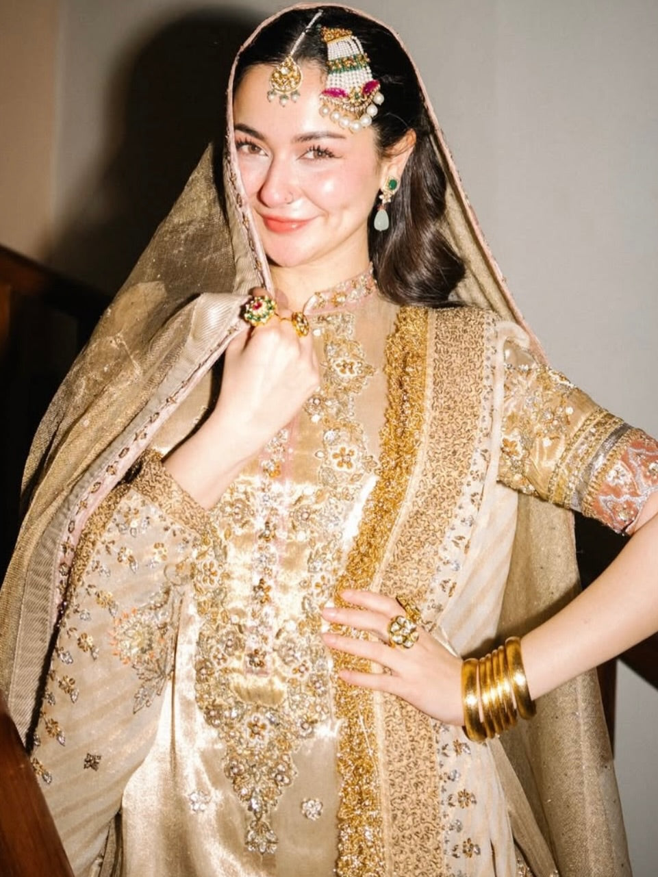 Close up of intricate dabka, zari and crystal handwork on golden bridal outfit-1