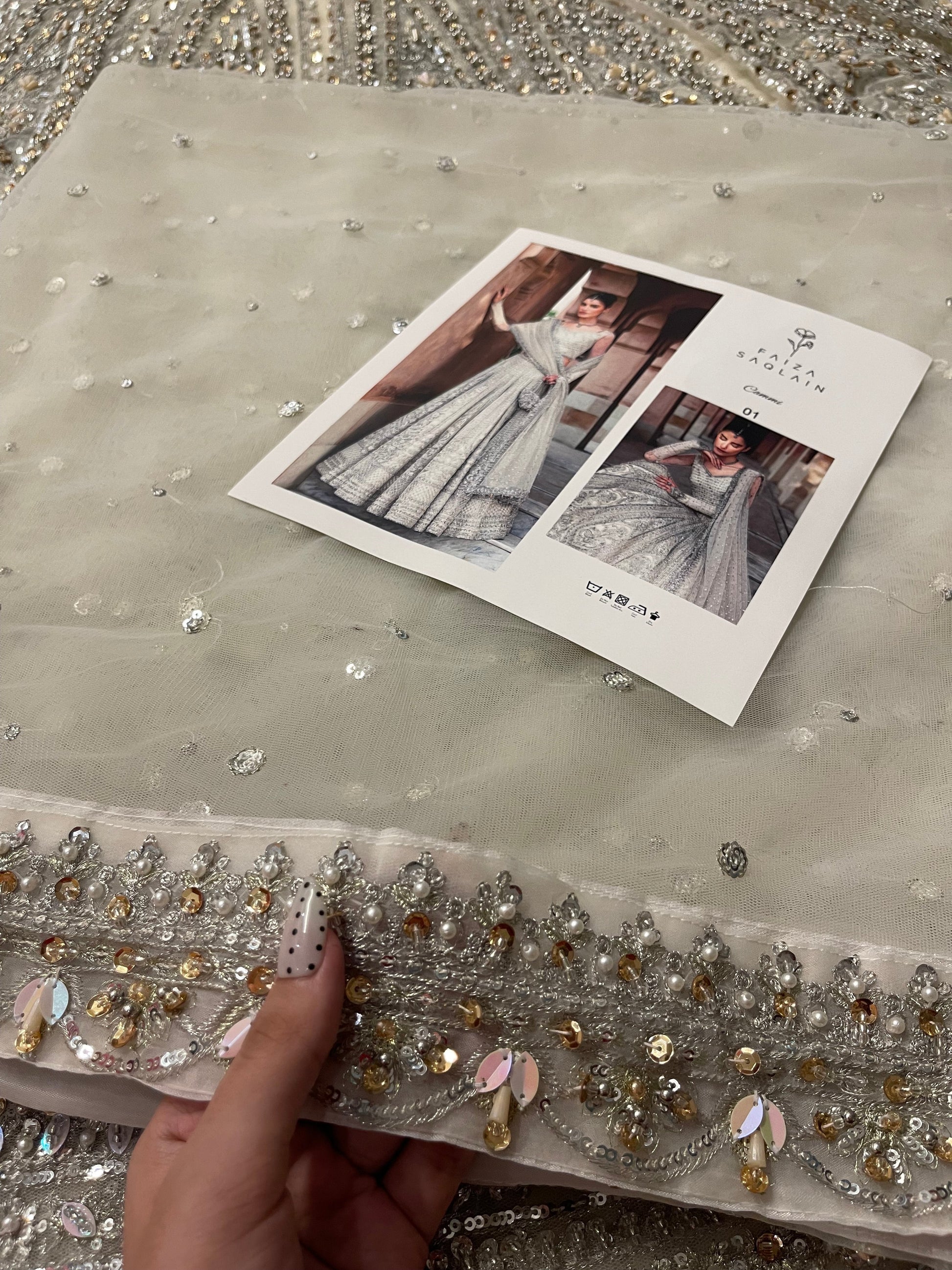 Closeup of Faiza Saqlain Cammi white net dupatta featuring embroidered border with resham tilla and crystal work