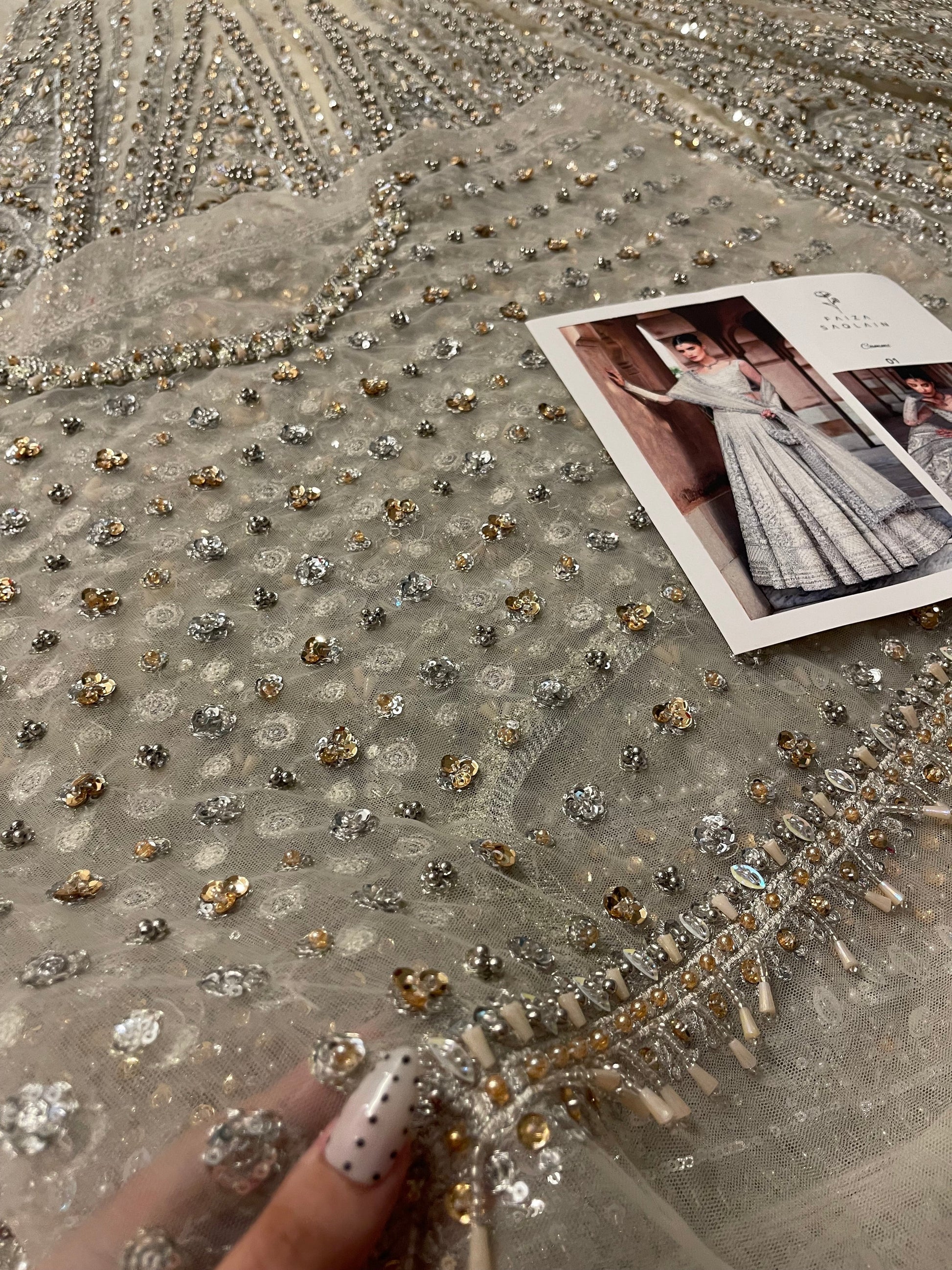 Front daman close embroidery view of Faiza Saqlain Cammi white bridal lehenga with detailed hand embellishments and delicate motifs