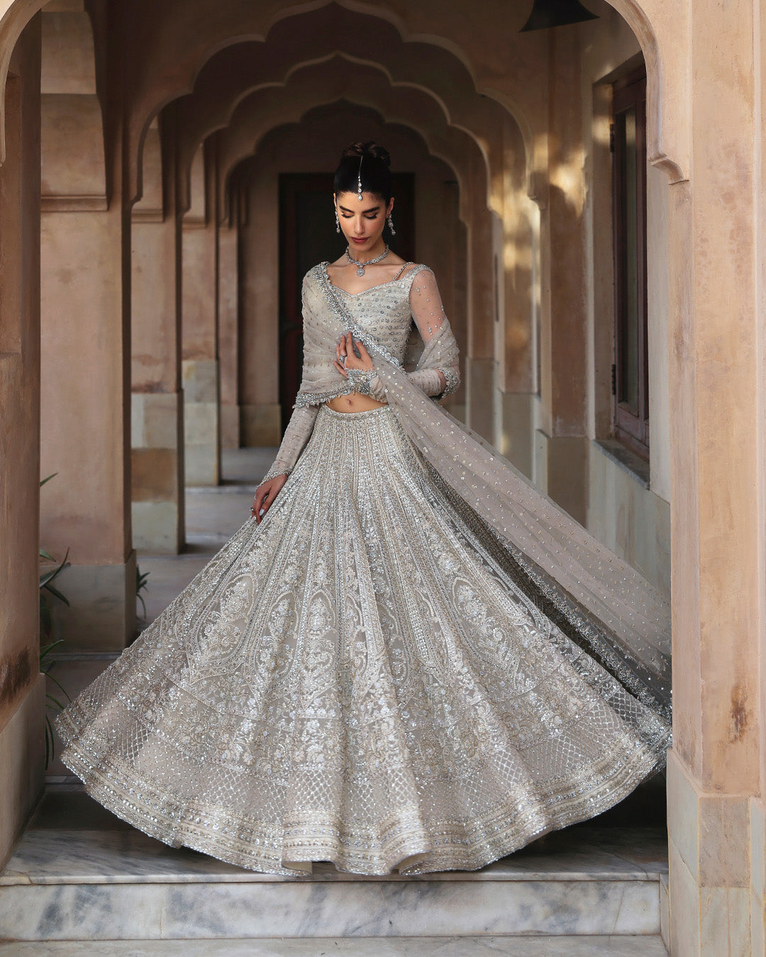 Full embroidery view of Faiza Saqlain Cammi white net lehenga with intricate hand embellishments