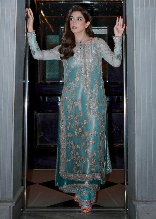 Ferozeah Sara Rohale Asghar luxury aqua embroidered formal dress front view
Aqua luxury formal dress with silver embroidery by Sara Rohale Asghar