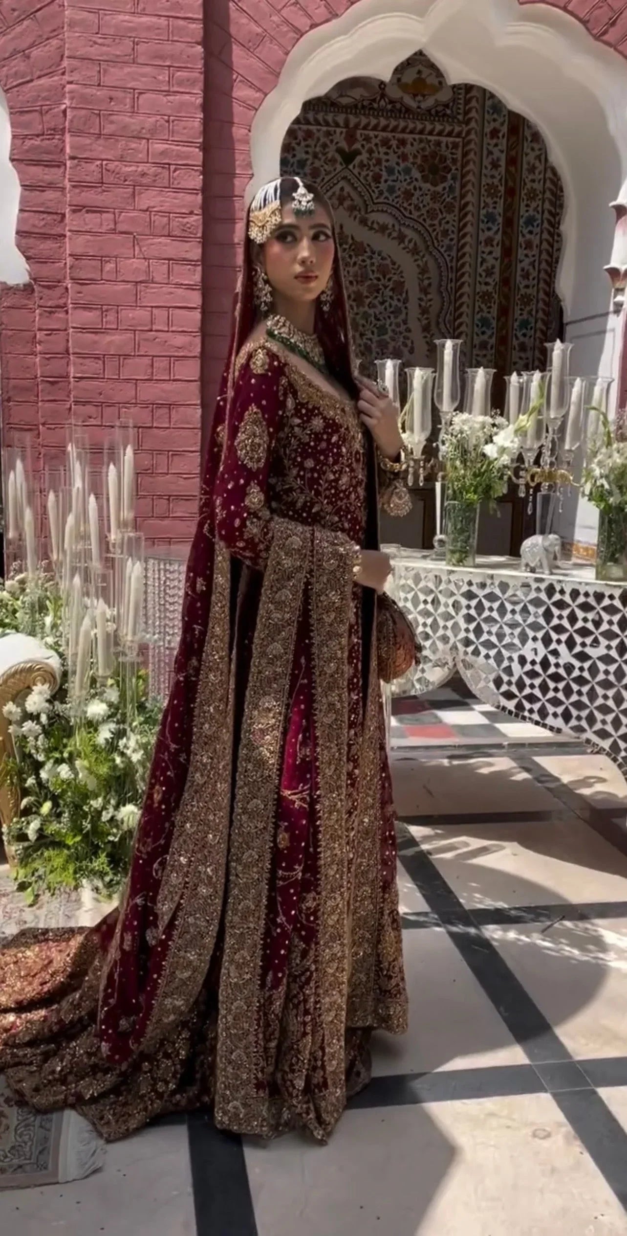 Ishq series maroon bridal lehenga side pose