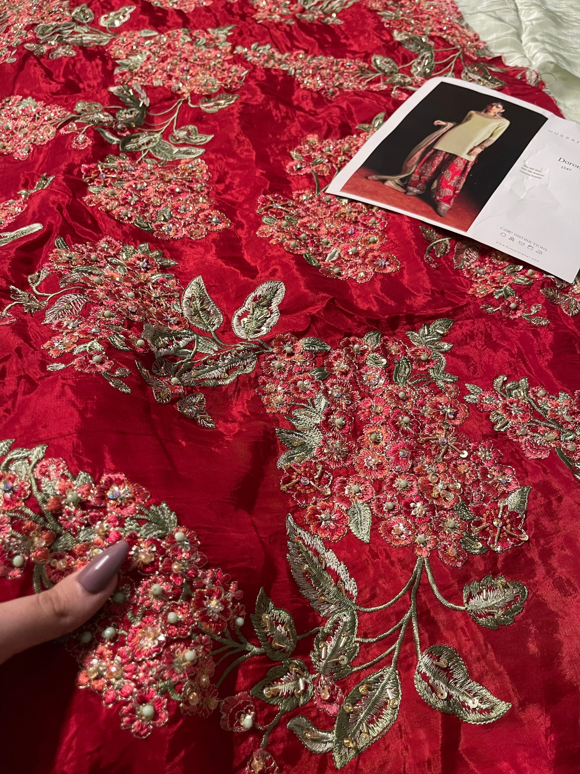 Close up of hot pink shalwar panel embroidery with mukaish and sequins detailing