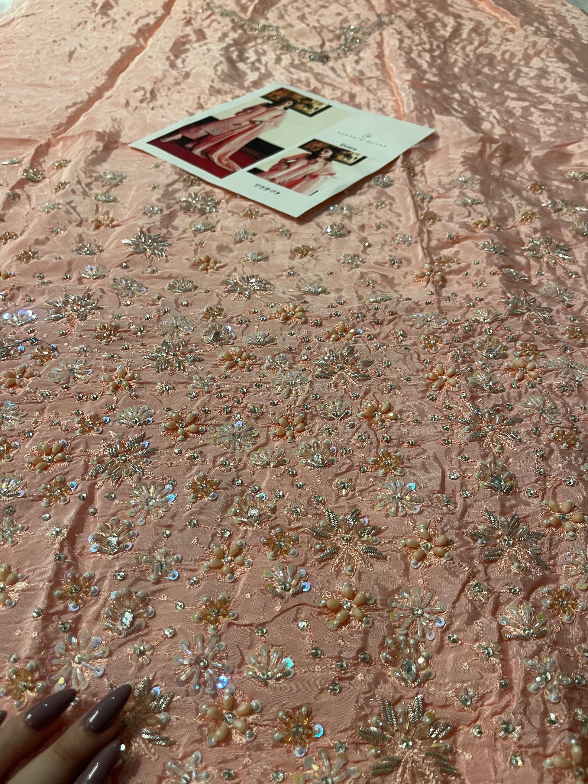 Closeup of Hussain Rehar Evara daman showing detailed floral embroidery and sequin work on raw silk