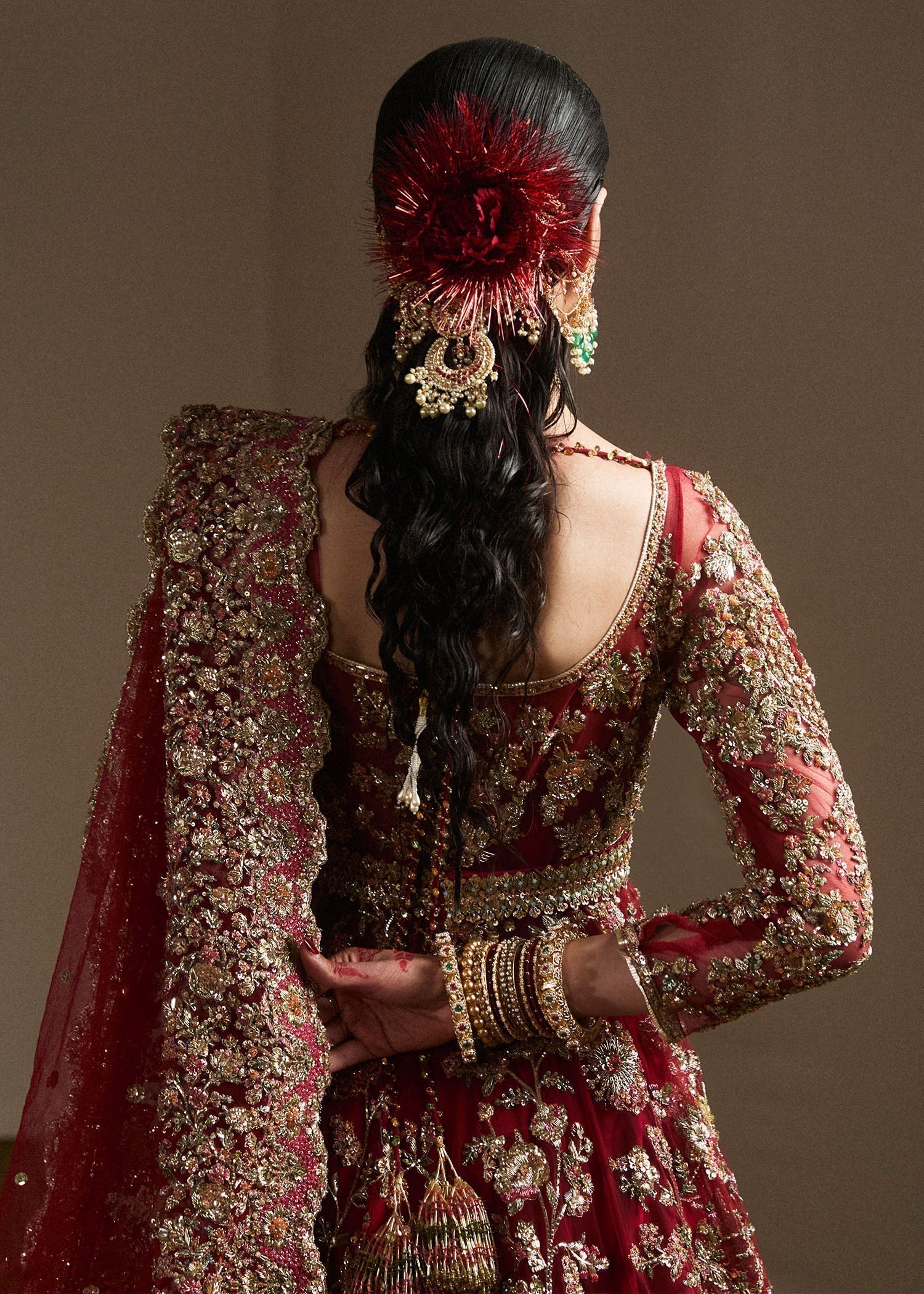 Back view of Qashqaye by Hussain Rehar ruby bridal lehenga with embellished dupatta