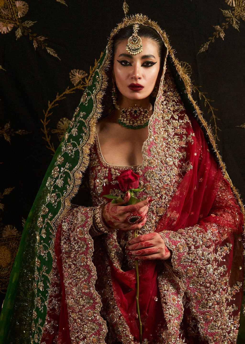 Close view of Hussain Rehar Qashqaye ruby bridal pishwas showing detailed gotta tilla cut dana and sequin hand embroidery