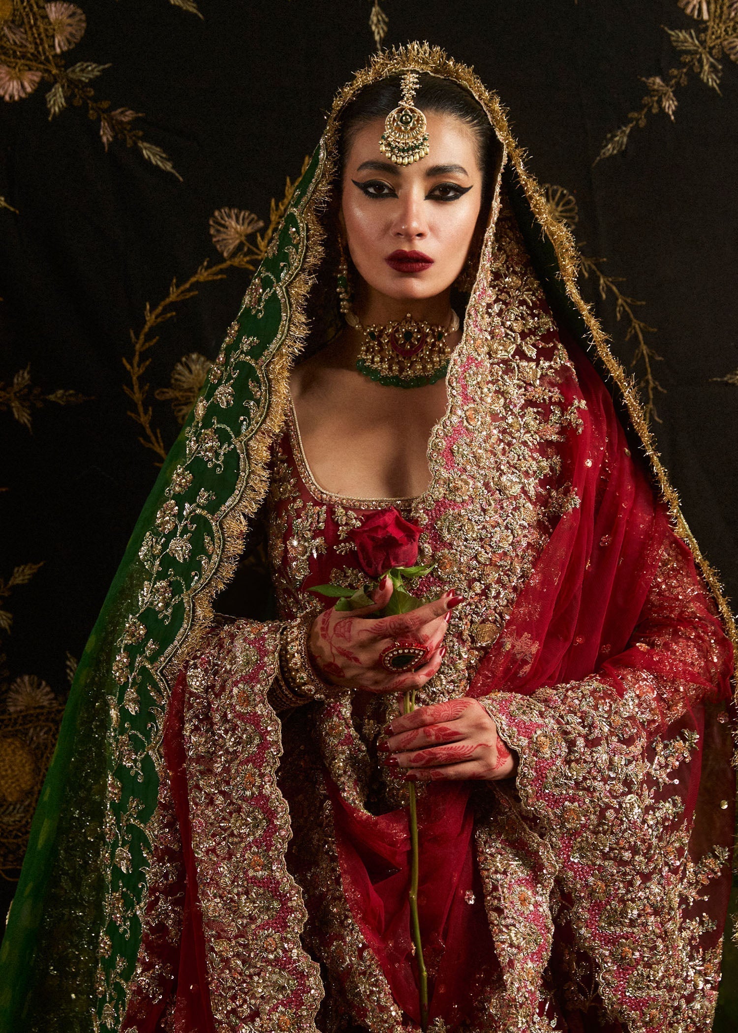 Close view of Hussain Rehar Qashqaye ruby bridal pishwas showing detailed gotta tilla cut dana and sequin hand embroidery