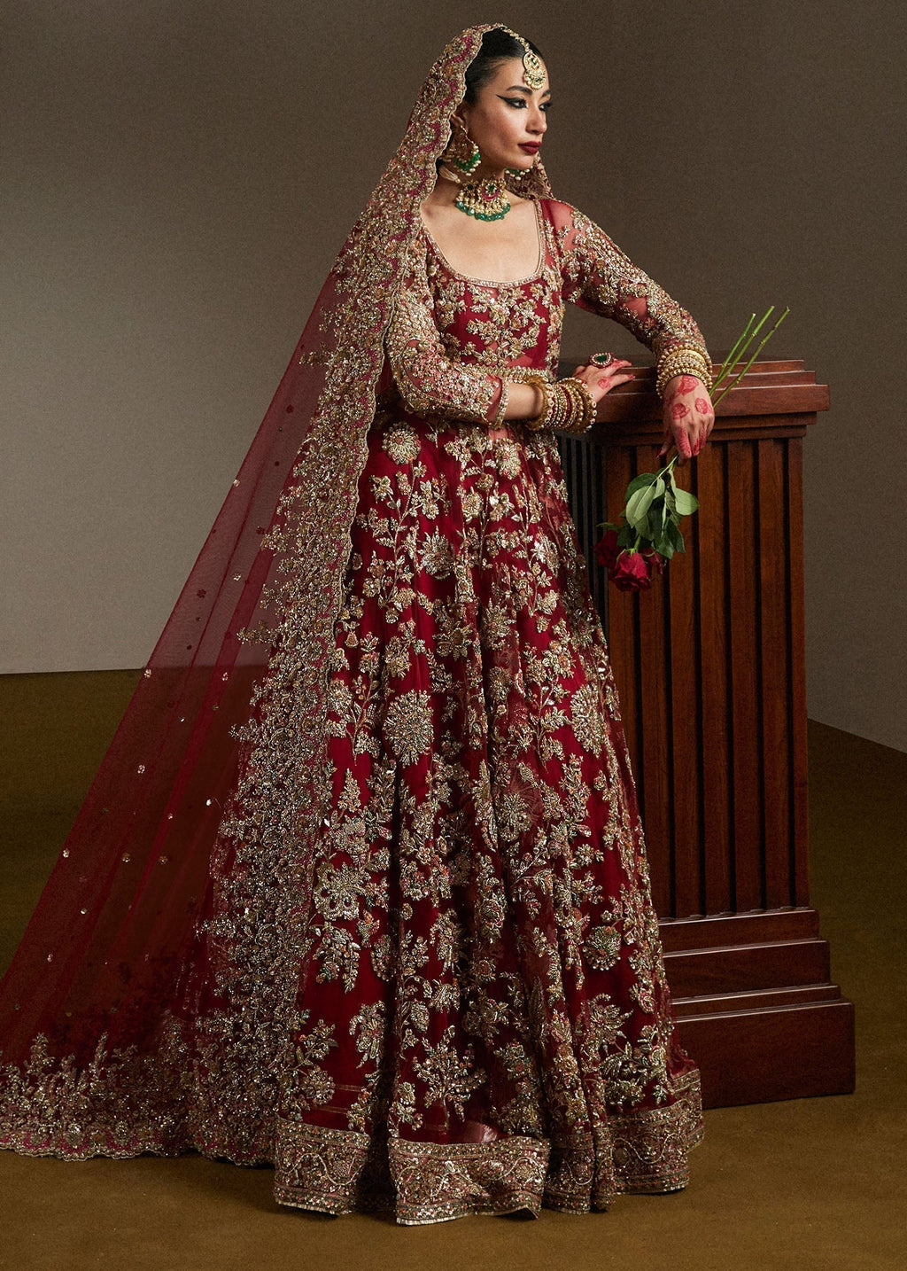 Side view of ruby bridal pishwas lehenga Qashqaye by Hussain Rehar