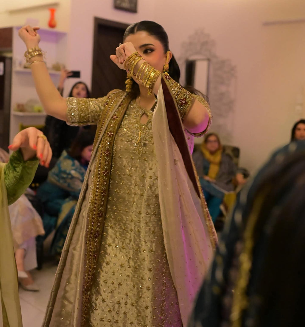 Close-up detail of Nooré Champagne Royale by Bisma Noor highlighting intricate hand embellishments, sequins, crystals, and fine zari embroidery.