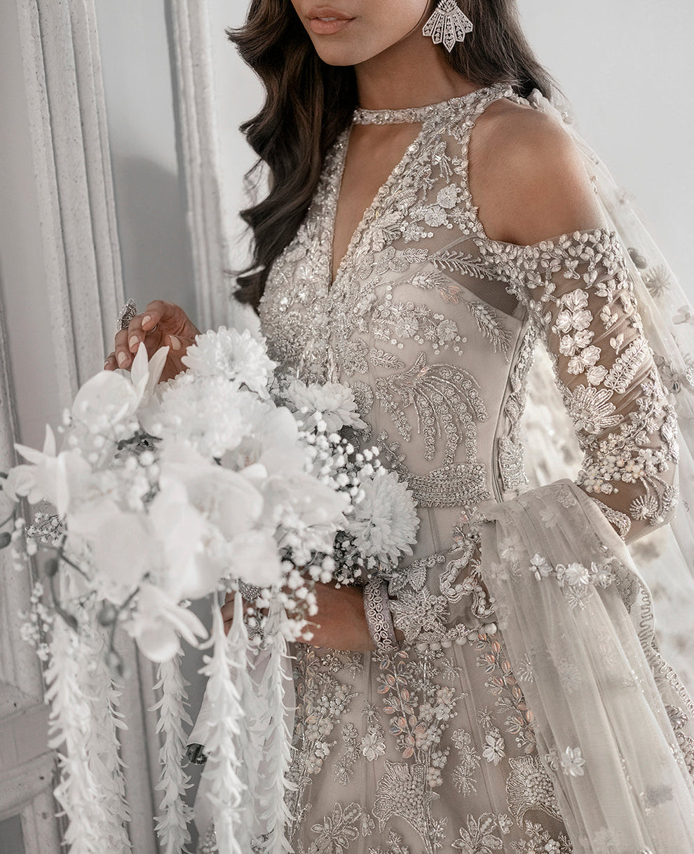 Republic Womenswear  bridal ensemble with intricate floral embroidery
Luxury pastel formal gown with detailed embellishments Republic 