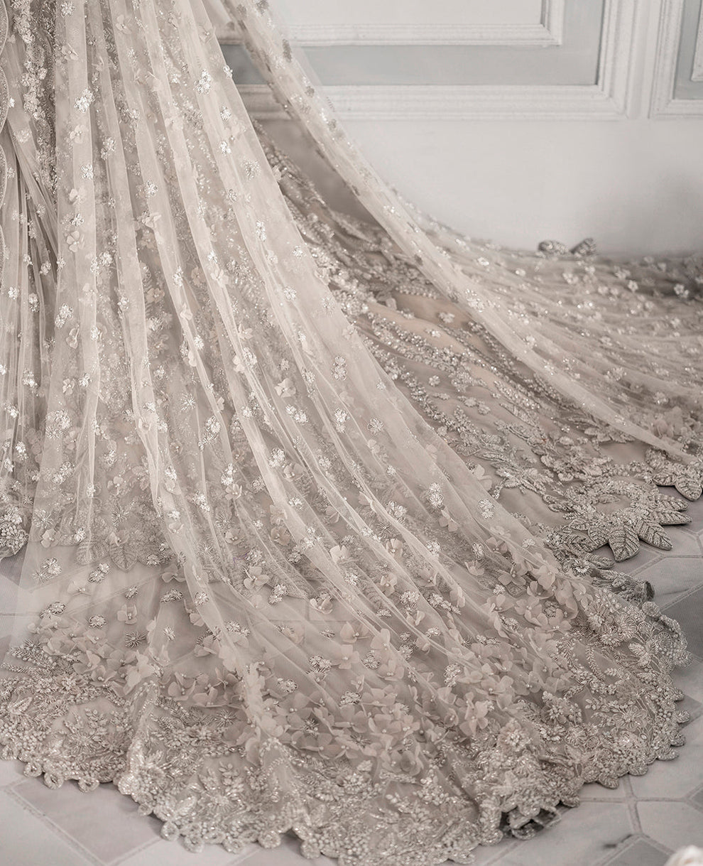 Republic Womenswear  bridal ensemble with intricate floral embroidery
Luxury pastel formal gown with detailed embellishments Republic 