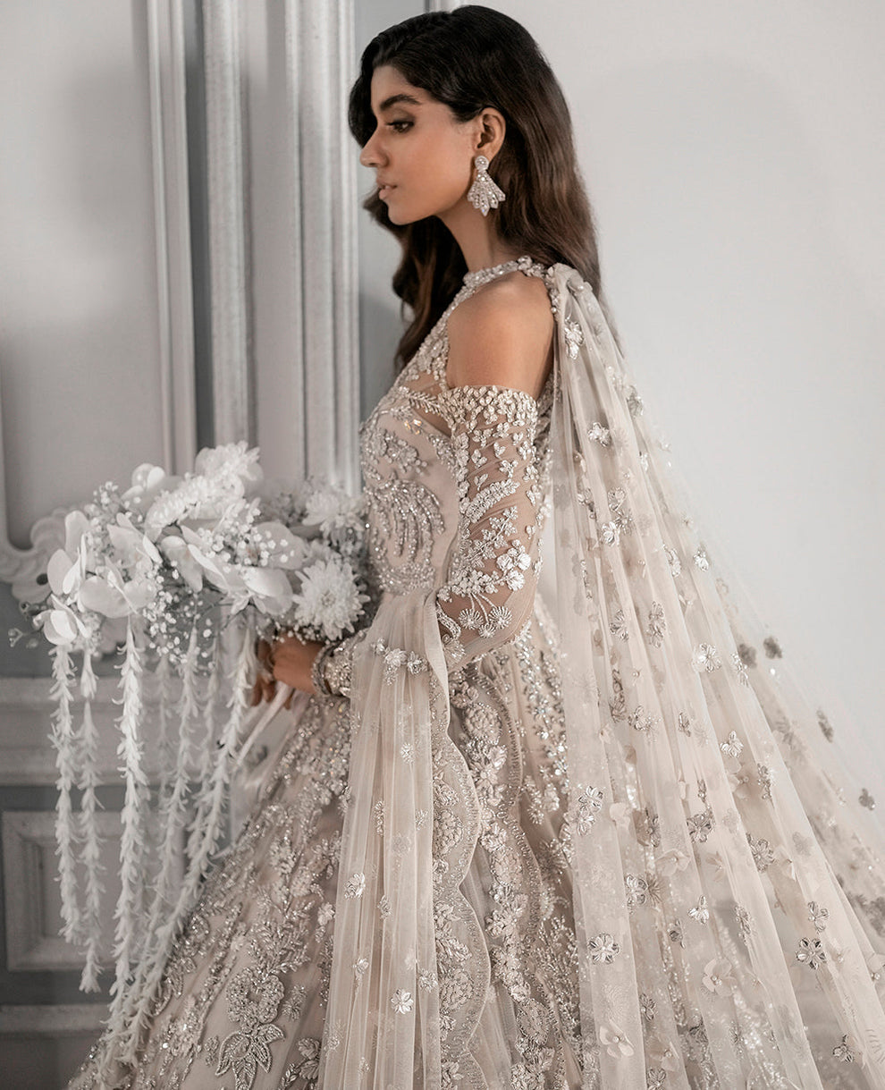 Republic Womenswear  bridal ensemble with intricate floral embroidery
Luxury pastel formal gown with detailed embellishments Republic 