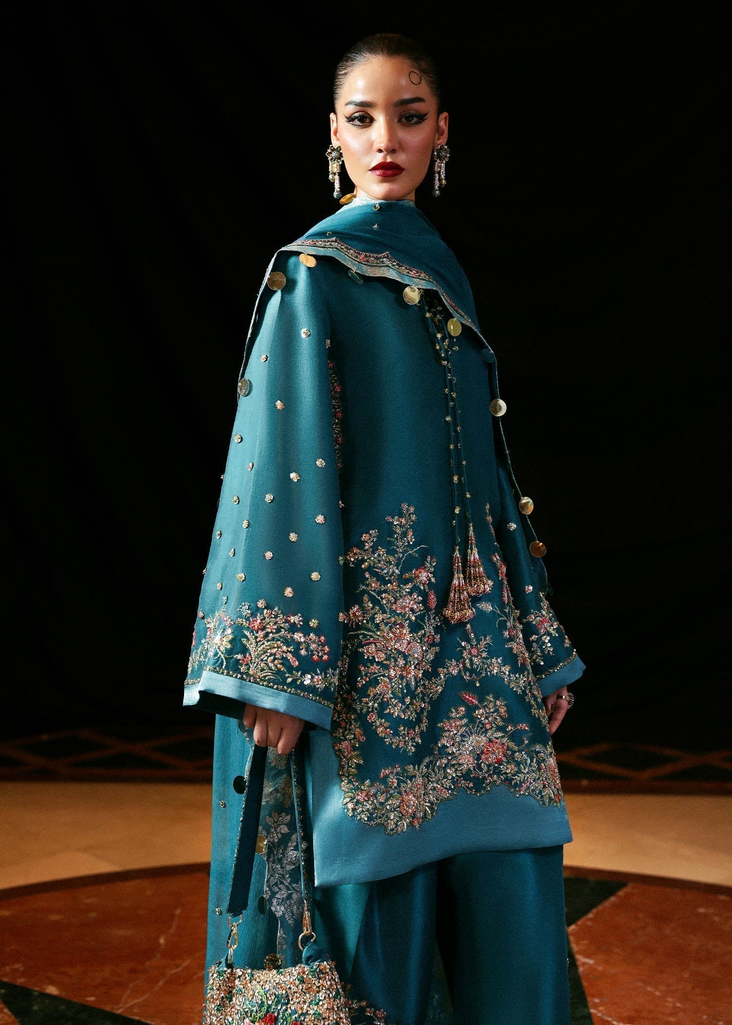 Luxury Hussain Rehar Verta outfit detailed embroidery close up
Elegant teal green embroidered formal ensemble full look