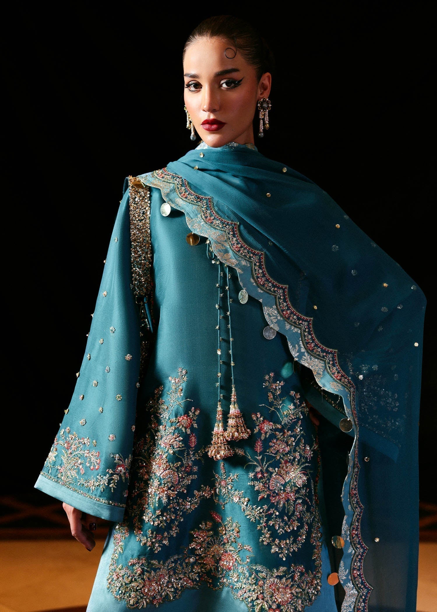 Luxury Hussain Rehar Verta outfit detailed embroidery close up
Elegant teal green embroidered formal ensemble full look