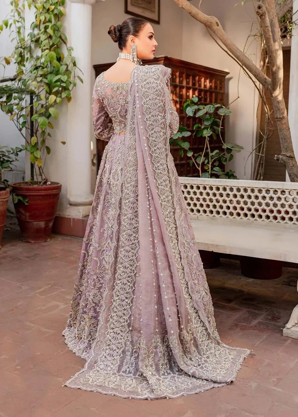 Back view of lilac bridal lehenga choli by Kanwal Malik Zaarish with organza dupatta