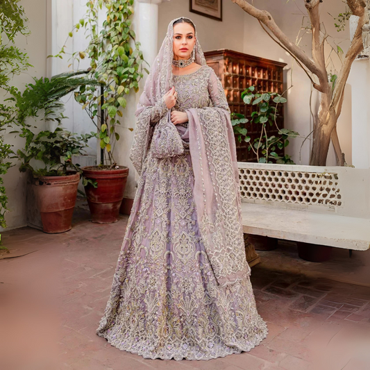 Woman wearing Zaarish Kanwal Malik lilac embroidered bridal lehenga choli front view